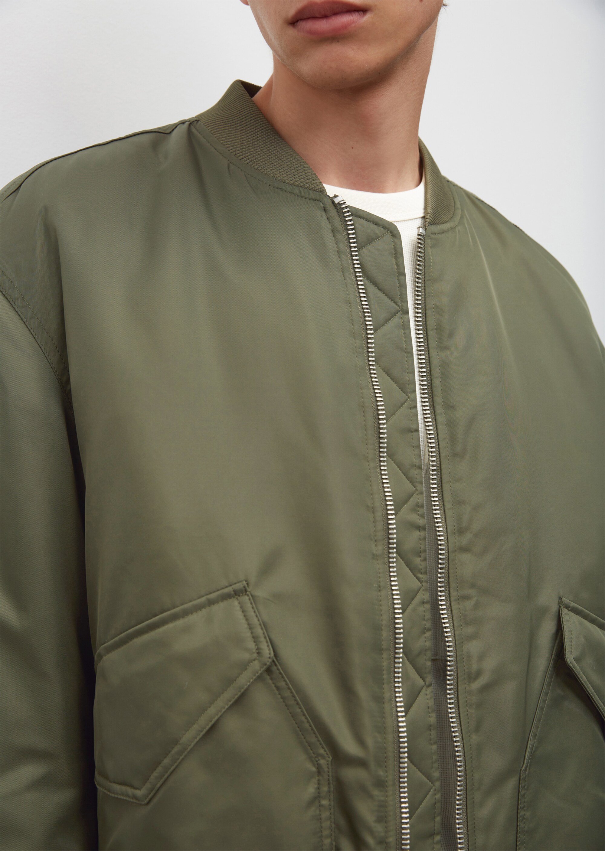 Bomber jacket made of shiny, recycled nylon fabric